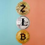 Colorful display of Zcash, Litecoin, and Bitcoin coins on gradient background.